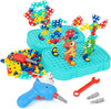 Colorful toy construction set with building blocks and tools on a white background