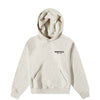 Light oatmeal Fear of God Essentials kids fleece hoodie by THE EA STORE, showing soft fabric and cozy fit.