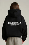 Black Fear of God Essentials Kids fleece hoodie from THE EA STORE, shown with a cozy, soft fabric and hooded design.