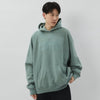 Essentials Fear of God Essentials hoodie in Sycamore color, featuring a relaxed fit and soft fabric, displayed on a hanger.