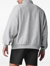 Alo Yoga men's and women's heather grey half-zip sweatshirt with fleece material and quarter-zip design, casual athletic style.