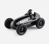 Black toy race car on a white background