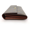 Authentic Louis Vuitton monogram canvas long wallet with designer flap, featuring multiple card slots and bill compartments.