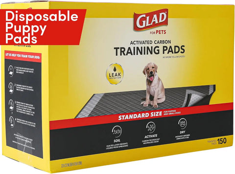 Glad for Pets black charcoal puppy pads in sealed packaging for indoor dog training and crate use.