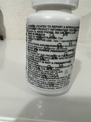 White pill bottle with black text label on a white background