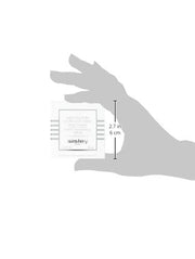 Sisley product packaging held in a hand with size measurement details.
