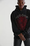 Black Sp5der Essential hoodie with red web rhinestone logo, authentic Young Thug streetwear pullover from THE EA STORE.