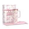 Floral-patterned mug with pink handle and matching pink box on a white background