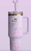 Floral-patterned water bottle with handle on a light purple background