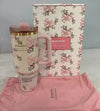 Pink Stanley tumbler with floral design, matching pink pouch, and floral-patterned box on a light gray background.
