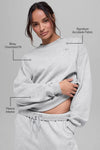 Alo Yoga unisex Heather Grey fleece crewneck sweatshirt with ribbed cuffs and collar, laid flat for display.