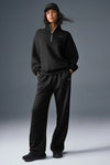Black Alo Yoga Accolade half-zip fleece sweatshirt for men and women, unisex quarter-zip pullover with soft fleece fabric.