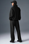 Black Alo Yoga unisex Accolade half-zip sweatshirt featuring a quarter-zip fleece pullover with a relaxed fit and logo detail.