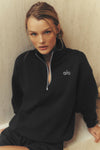 Black Alo Yoga Accolade half-zip sweatshirt for men and women, quarter-zip fleece pullover with logo detail.