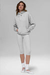 Alo Yoga Unisex Accolade Heather Grey Fleece Hoodie, front view showing soft fleece fabric and relaxed fit.