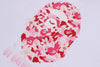 White and pink camo BAPE Sakura Ape Head Tee from THE EA STORE, featuring a Japanese-inspired ape graphic on the front.