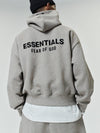 Essential hoodie in dark oatmeal from Fear of God Essentials by THE EA STORE, shown in a casual front view.