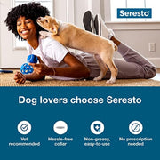 Woman holding a small dog with Seresto product 