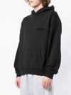 Fear of God Essentials Hoodie Stretch Limo in black, featuring a relaxed fit and soft fabric, displayed on a hanger.