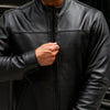 Men's black genuine leather rider jacket with classic design, featuring a front zipper, collar, and stylish details.
