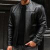 Men’s black genuine leather rider jacket featuring classic design, zippered pockets, and a stylish collar from THE EA STORE.