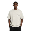Light oatmeal Fear of God Essentials Tee featuring a classic crew neck and comfortable fit, displayed on a plain background.