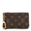 Louis Vuitton Monogram leather key pouch and coin purse with key chain set, featuring classic designer monogram pattern and compact style.