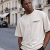 Fear of God Essentials light oatmeal T-shirt, casual unisex tee from THE EA STORE's core collection, versatile everyday wear.