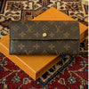 Louis Vuitton Monogram Canvas Long Wallet featuring a sleek designer flap design and gold-tone hardware.