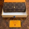 Authentic Louis Vuitton Monogram Canvas Long Wallet with flap closure, featuring classic LV monogram pattern and leather accents.