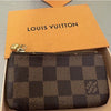Louis Vuitton Damier Ebene leather key pouch with gold-tone hardware, designer coin and key purse set in a compact wallet style