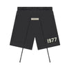 Essentials Fear of God 1977 Sweat Shorts in iron color, casual fit, made by THE EA STORE, displayed on a neutral background.