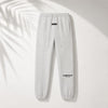 Light oatmeal Fear of God Essentials relaxed sweatpants from THE EA STORE, showing soft fabric and comfortable fit.