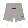 Dark oatmeal Fear of God Essentials sweat shorts from THE EA STORE, featuring a relaxed fit and soft fabric for casual wear.