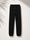 Essentials Fear of God Essentials Off Black sweatpants from THE EA STORE, featuring a relaxed fit and soft fabric.