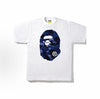 White and blue BAPE ABC Camo Ape Head Tee from THE EA STORE, featuring a camo pattern and ape head graphic on the front.