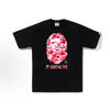 Black and pink camo BAPE Sakura Ape Head Tee from THE EA STORE, featuring a graphic of the ape head logo on the front.
