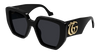 Gucci oversized square sunglasses with black acetate frame and gold interlocking double G logo, stylish and bold eyewear.