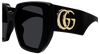 Gucci oversized square sunglasses with black acetate frame and gold interlocking double G logo, stylish and bold eyewear.
