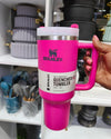 Dark pink Stanley 40 oz Quencher H2.0 FlowState tumbler with handle, lid, and straw, insulated stainless steel travel cup.