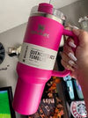 Stanley 40 oz Quencher H2.0 FlowState tumbler in dark pink, insulated stainless steel travel cup with handle, lid, and straw.