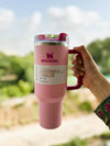 Stanley Quencher H2.0 FlowState Tumbler 40oz in Flamingo Barbie Pink, durable stainless steel drink tumbler with a lid.