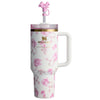 Stanley x Love Shack Fancy 40oz Ribbon Rosa FlowState H2.0 stainless steel spill-proof tumbler with floral pattern, handle, and pink straw