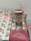 Stanley x Love Shack Fancy stainless steel water bottle in gift box, featuring floral design and durable construction.