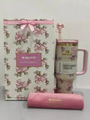 Stanley x Love Shack Fancy stainless steel water bottle in gift box, featuring floral design and durable construction.